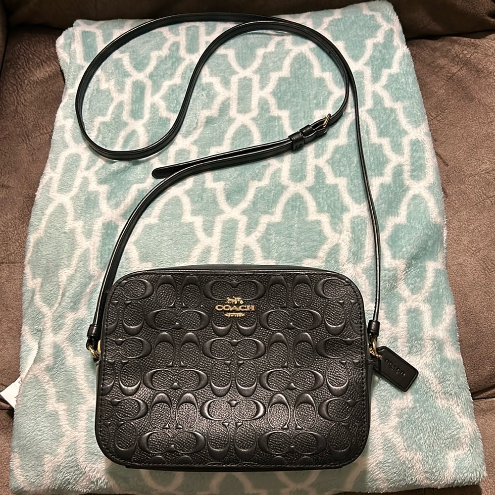 Coach small black camera bag size 71/2  inches length width 5 inches, strap 42in